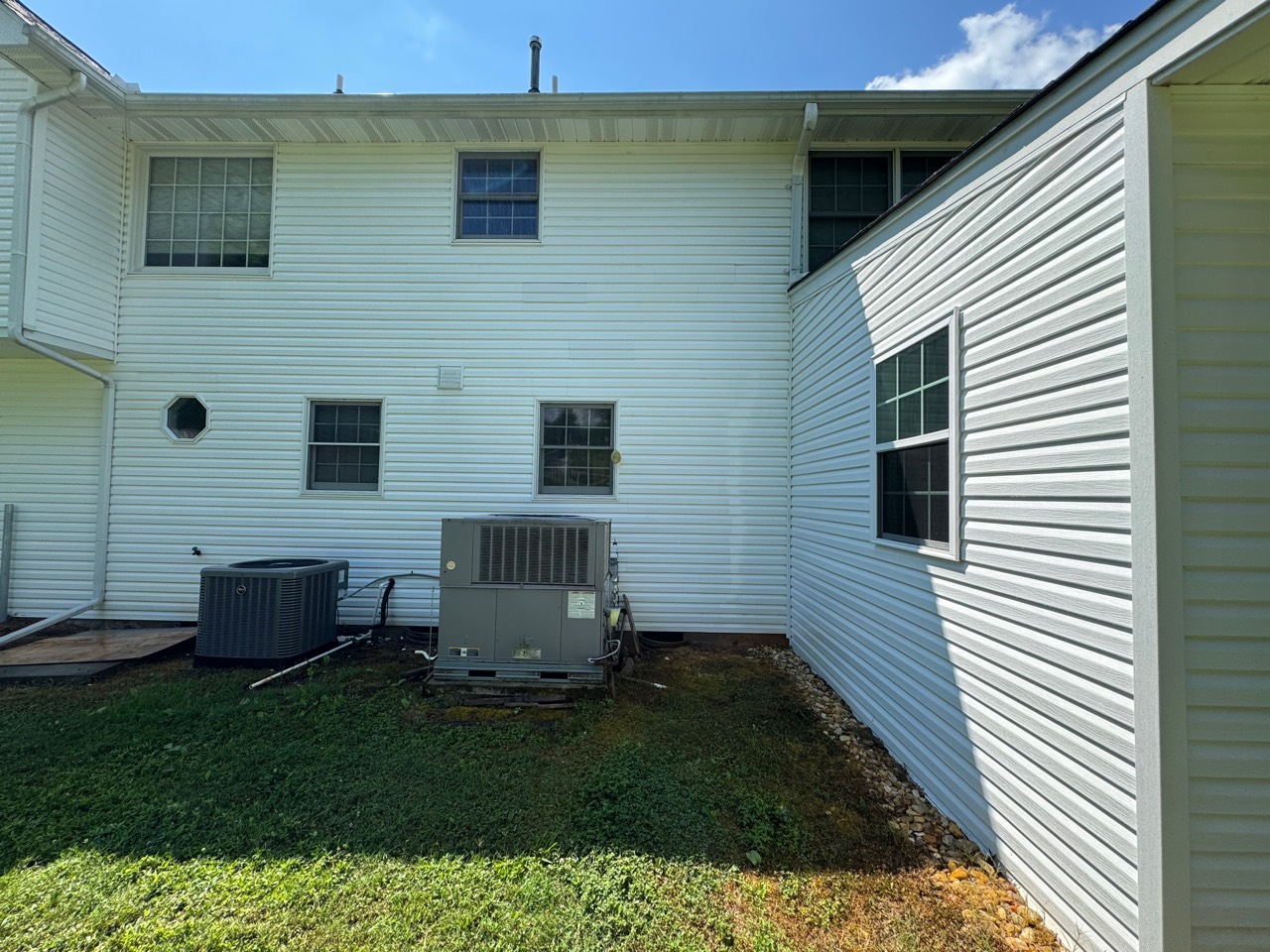 Clean house exterior after professional soft washing